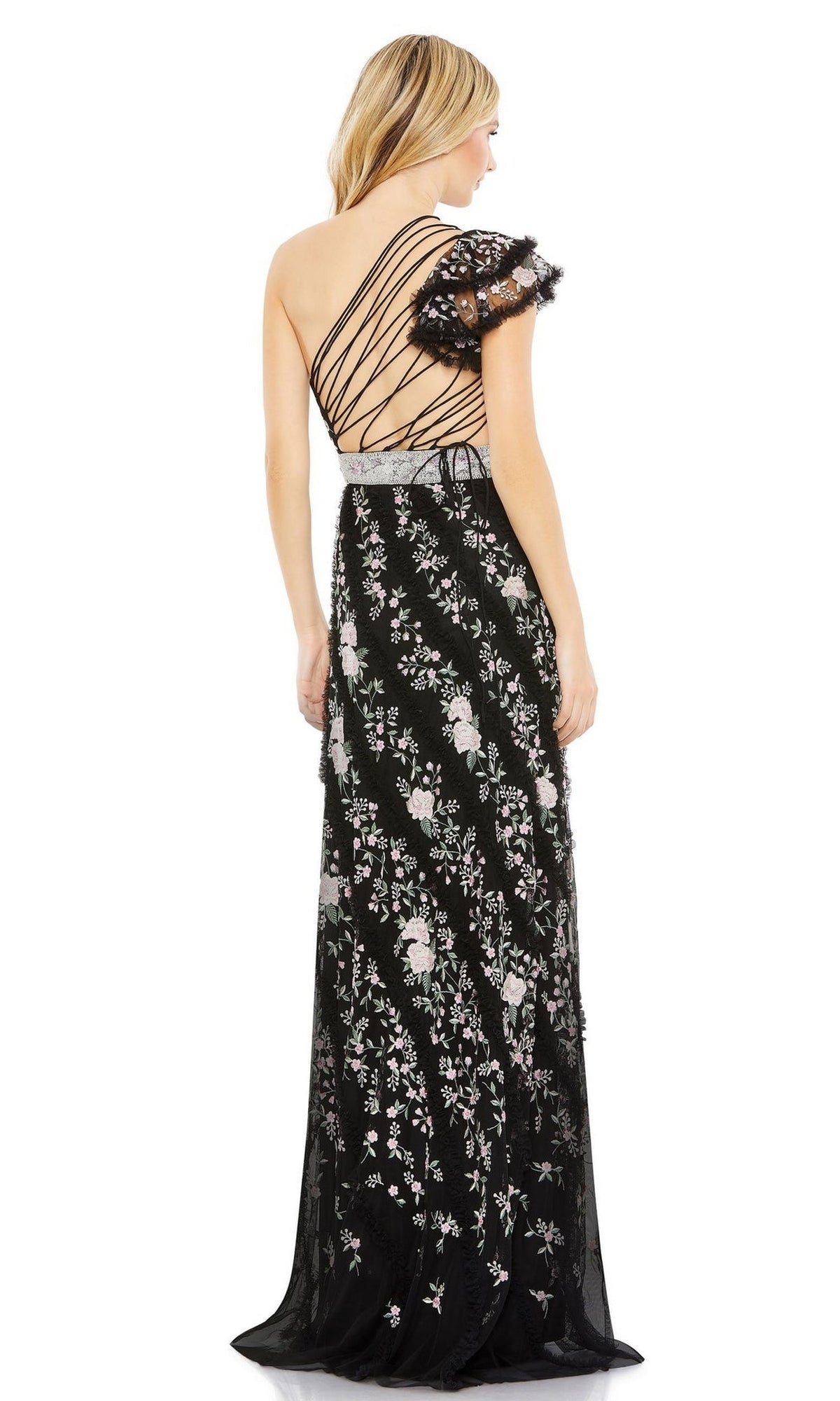A woman faces away, wearing the Long Formal Dress 70160 by Mac Duggal, featuring embroidery, sheer fabric, an asymmetrical ruffled sleeve, and multiple thin straps across the open back.